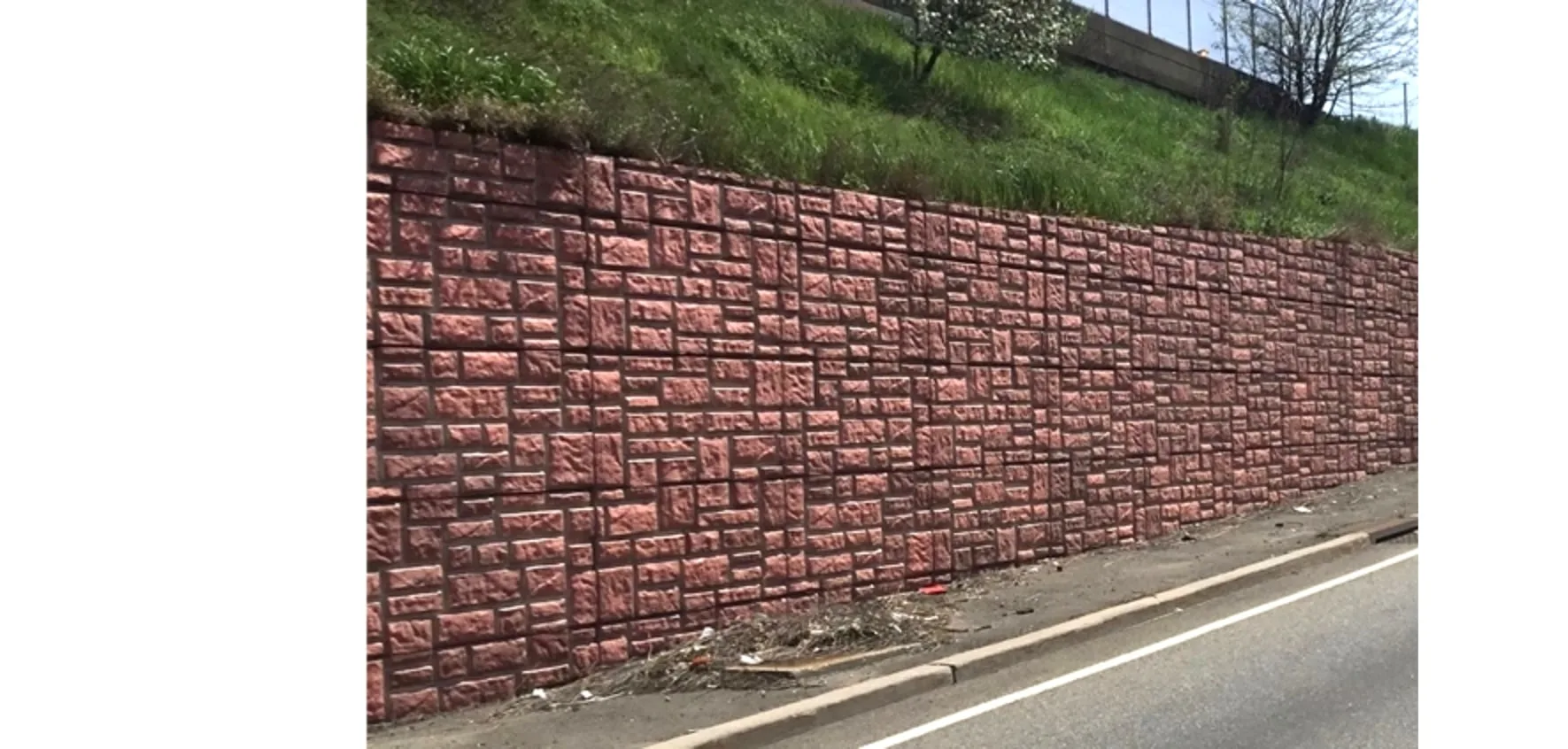 Highway retaining wall protected with a ceramic concrete surface treatment