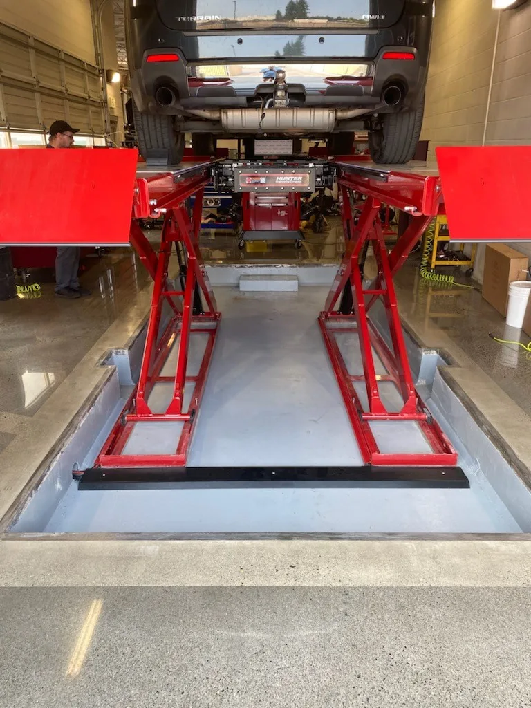 Glossy industrial floor coating in an automotive workshop