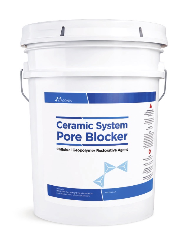 A five gallon white plastic pail of Ceramic System Pore Blocker with a blue and white product label, photographed on a plain background