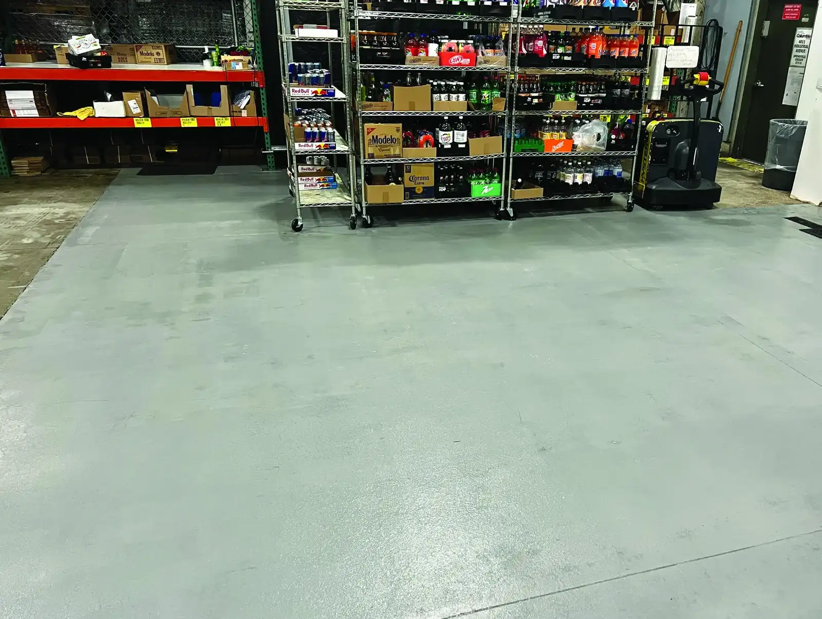Restored concrete floor coating at Columbia Distribution after acid damage