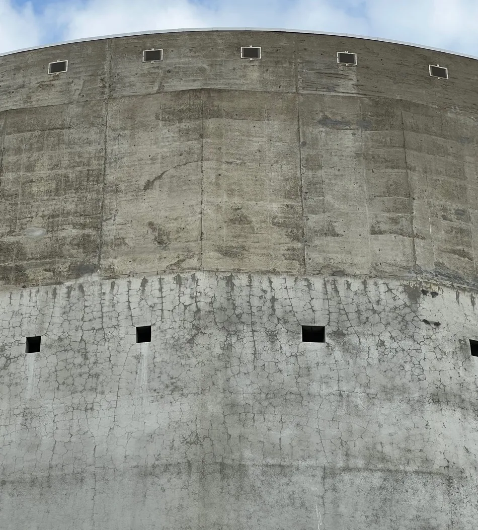Salt-stained, cracked concrete water reservoir before treatment, Sacramento