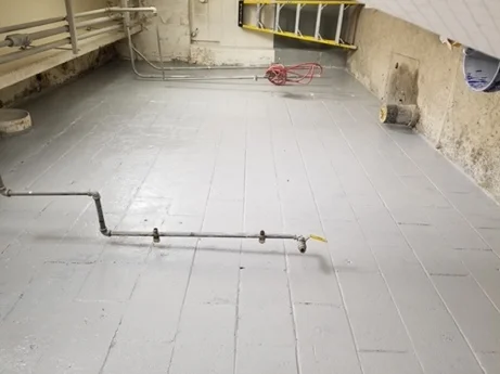 Ceramic surface treatment on a plant room concrete floor, coated and sealed against microbial acid